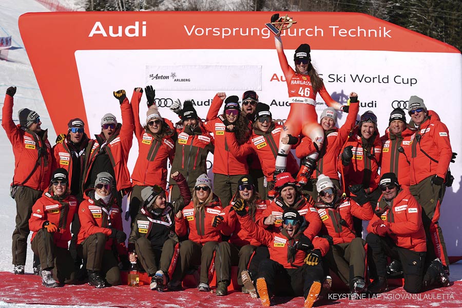 Second placed Switzerland's Malorie Blanc, celebrates with the team after completing an alpine ski, women's World Cup downhill race, in St. Anton, Austria, Saturday, Jan. 11, 2025. (AP Photo/Giovanni Auletta)